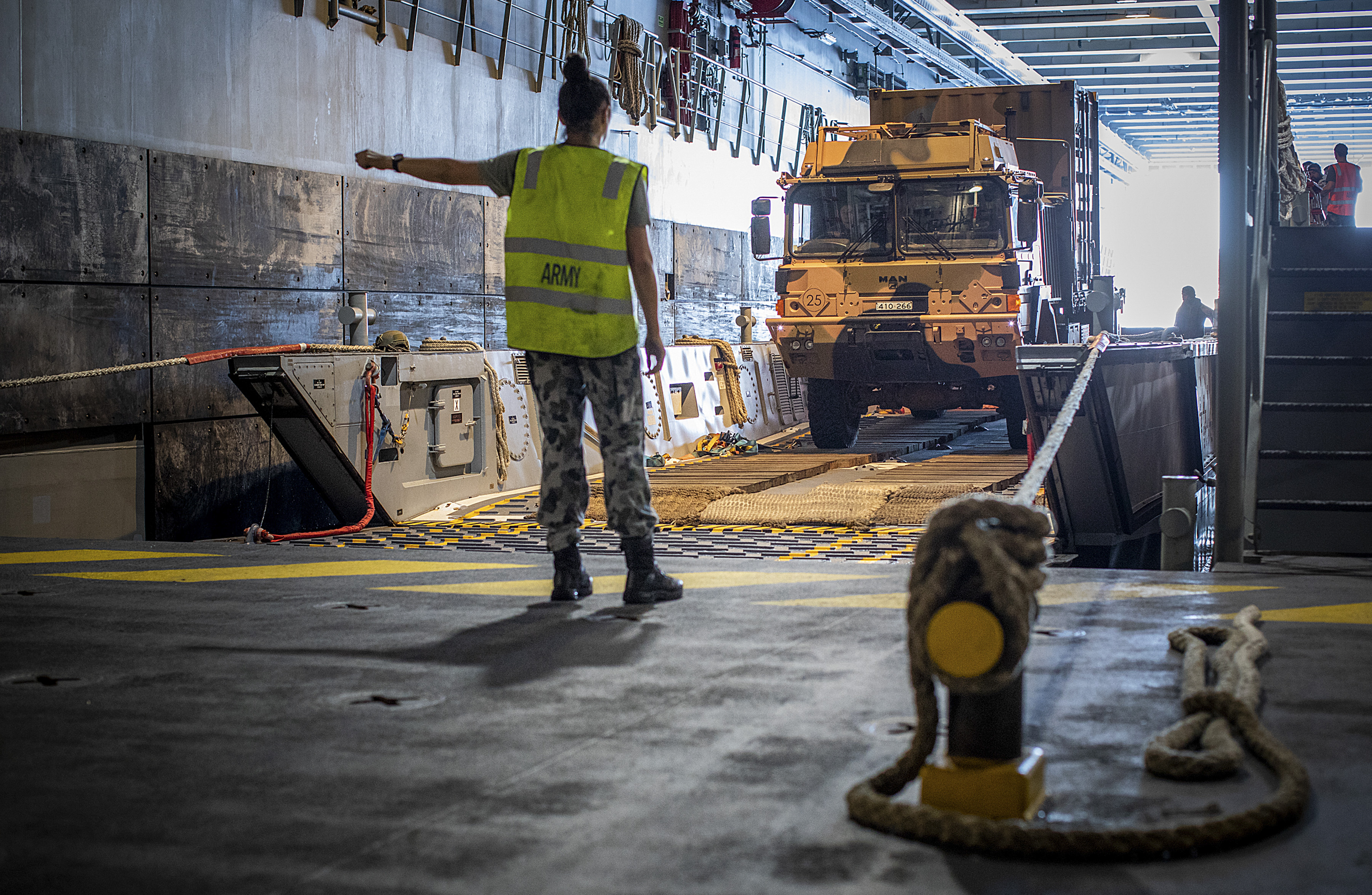 ADF member directing cargo